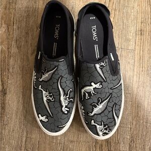 TOMS Black and Gray Dinosaur Slip-Ons